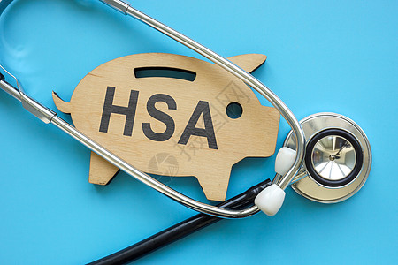 有HSA健康储蓄账户和听诊器签名的小猪银行图片