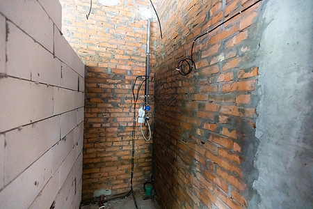 修复建筑物中的布线 电线 接线 建筑物墙上的插座 家庭维修 电缆公寓电压连接器装修活力建筑电气工作安装金属图片