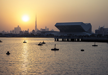 上巳节迪拜节市日落图书馆在现场的新建筑以及世界上最高的背景建筑财富玻璃访问假期景观天气城市太阳建造建筑学背景