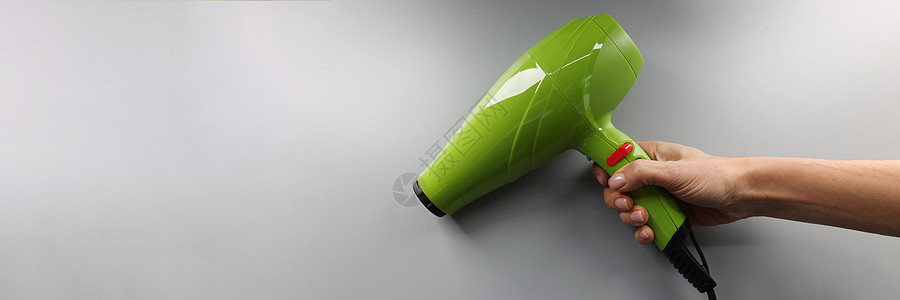 品牌新发干机型 手头上烘发的亮绿色照明装置图片