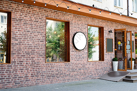室内外咖啡厅 用红砖墙 白色圆形模型设计标志图片