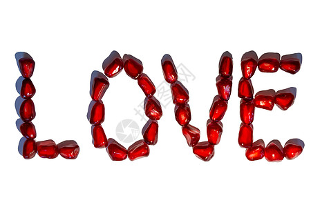 为爱而拼字体由红石榴种子写成的爱情词 情人节的概念 符号模式 白种背景孤立背景