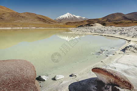 的盐湖 日出时的火山风景 智利阿塔卡马戏剧性橙子公共公园天空旅行反射高原景观风景火山图片