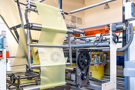 生产塑料袋的自动自动电话线自动化商业工具工厂机器塑料蓝色工程植物工作图片