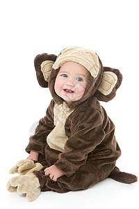 穿着猴子装扮的婴儿女性乐趣辣椒享受影棚女孩微笑相机奇装异服戏服图片