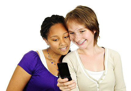 使用移动电话的少女女学生白色女孩们青年手机朋友们八卦微笑朋友多样性图片