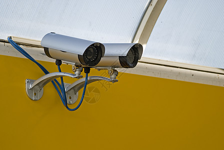 黄色摄像机监视摄像机设备视频智能电视监控凸轮镜片间谍安全手表背景