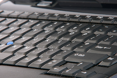 膝上型电脑键盘商业纽扣笔记本技术白色字母电子产品黑色背景图片