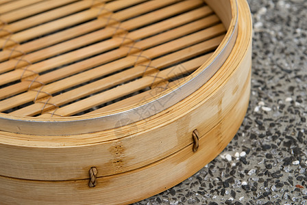 是用竹子制成的中国蒸汽船小吃盒子宏观厨具美食篮子饺子文化柳条木头图片
