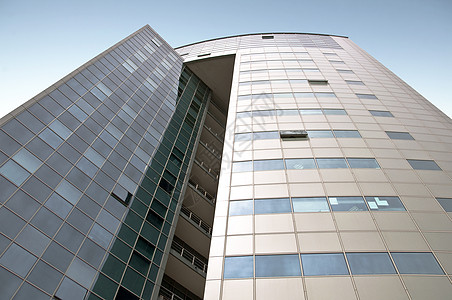 办公大楼的外墙是紧凑的建筑透明度城市玻璃窗窗户商业玻璃控制板金属光泽图片