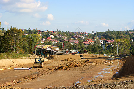 建筑场地建造棕色挖掘土壤勃起工人地面挖掘机赛道图片