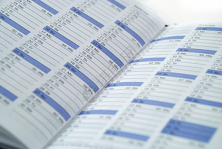 每日计划议程日程笔记本组织活动调度程序日历商业背景图片