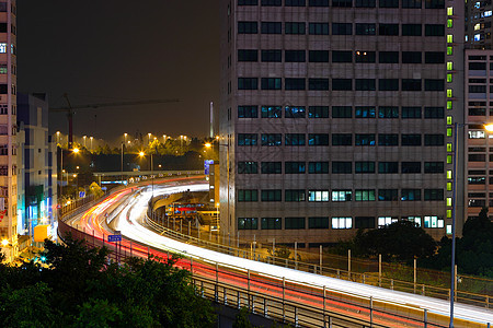 夜间与城市交接辉光旅行建筑速度景观公共汽车驾驶运输线条商业图片
