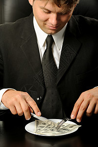 那个吃晚饭的生意人贪婪奢华团体男人领带货币沉思乐趣午餐盘子图片
