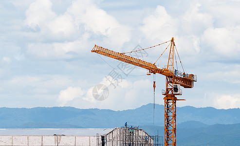 建筑工地大楼起重机天空蓝色财产工程城市商业吊装建造生长摩天大楼图片