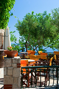 花园餐厅Cafe 露天咖啡厅风景空气叶子旅游蓝色阳光天空花园桌子露台背景