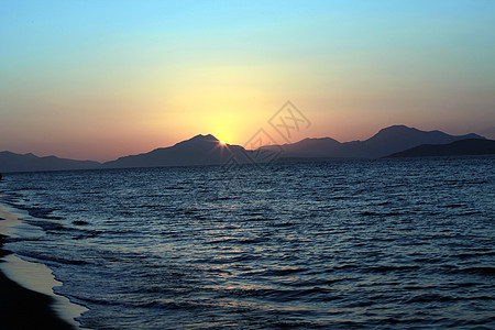 爱琴海日落乐趣魔法地平线反射学习射线海浪蓝色天堂天气图片