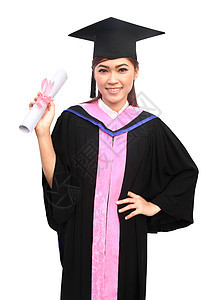 妇女有毕业帽和礼服 手举起握抱头丝带帽子微笑工作室学士文凭教育学生大学衣服图片