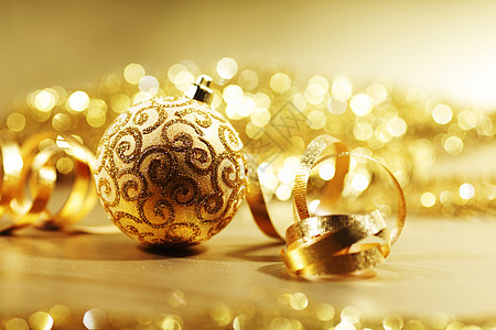 金色圣诞卡派对金子玻璃假期星星庆典装饰品丝带圆圈季节背景图片