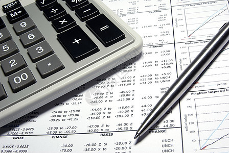 计算器 钢笔和带有图表的财务数据数字平衡贸易金融利润公司文档报告办公室馅饼图片