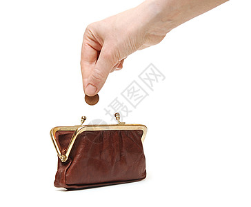 手把硬币扔在钱包里储蓄手指购物货币金融财富银行业白色棕色手臂图片