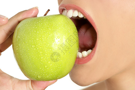 女性口口上苹果的宏女孩女士化妆品牙齿水果微笑宏观口红饮食食物图片