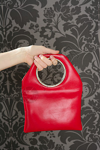 五十度灰灰壁纸上的红色时装红袋(旧式)背景