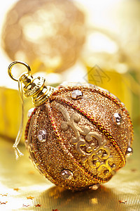 金金的圣诞节装饰传统金属庆典喜悦玻璃火花欢乐季节假期礼物图片
