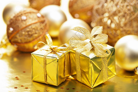 圣诞礼物和装饰金属季节喜悦展示欢乐盒子金子假期丝带礼物图片