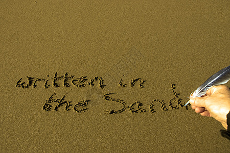 手写在沙子上 用羽毛结图片