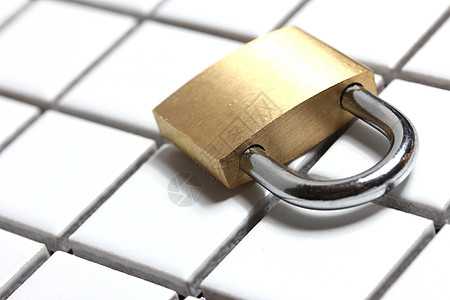 挂锁钥匙剪裁金子锐化几何学警卫小路力量瓷砖金属图片