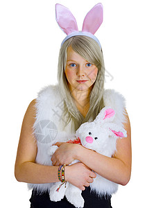 穿着衣服兔子年轻金发金发美女穿着玩具兔子的漂亮衣服背景
