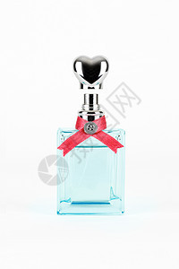 女性香水在美丽的瓶子里被隔绝女士香味化妆品芳香玻璃粉碎机礼物丝带蓝色气味图片
