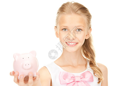 拥有小猪银行的可爱少女储蓄经济孩子财政微笑投资女性银行青春期小猪图片