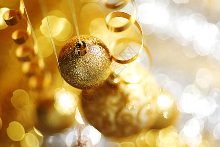 金金色圣诞金子团体玻璃魔法装饰品乐趣圆圈风格假期灯泡背景图片