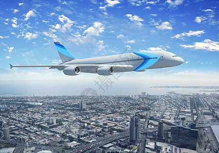 飞越城市上空的白色客机飞机旅行地球全景建筑天际风景景观建筑学旅游图片