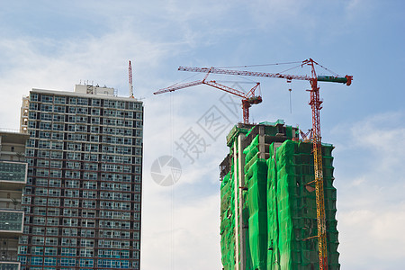 有起重机和建筑物的建筑工地工程对角线建造天空办公室公寓财产水泥脚手架商业图片