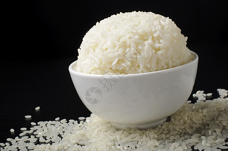陶瓷碗和打磨大米中的白蒸水稻图片