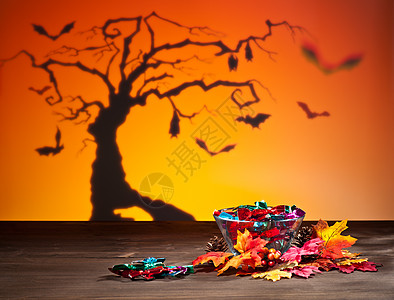 万圣节树蝙蝠和糖果庆典假期松果收成派对魔法橙子花环叶子童话图片