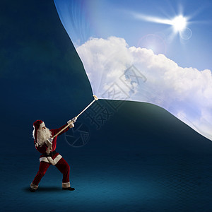圣诞老人用白天的天空拉旗图片