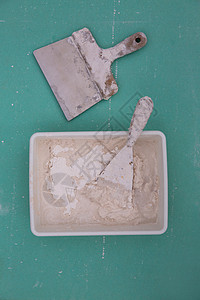石膏的粘土工具 如压实岩浆块状吸尘器石膏板手工工人石匠工作乡村维修水泥砂浆建筑图片