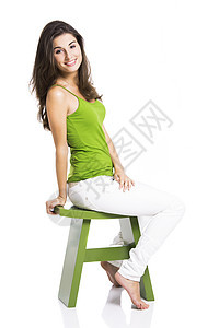 快乐的女人女孩成人乐趣椅子闲暇工作室黑发喜悦座位女性时髦的高清图片素材