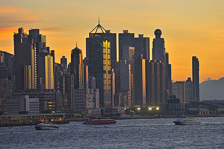 城市天空日落时 香港的天线城市天际建造景观旅游生活港口摩天大楼天空橙子背景