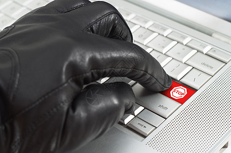 手戴黑皮手套的黑皮手套紧压在键盘旗帜钥匙警报攻击被骗骗局红色服务水平图片