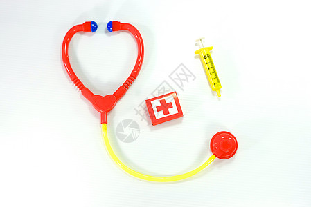 医疗工具注射器黄色十字玩具医生护士白色背景图片