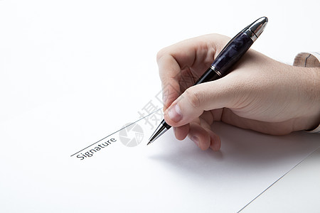 在人的手和笔中一部分手指协议职业交易墨水写作商业文档报名背景图片