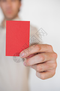 显示红色卡片的偶然商务人士推介会职业空白商业男人职场男性商务工作办公室背景图片