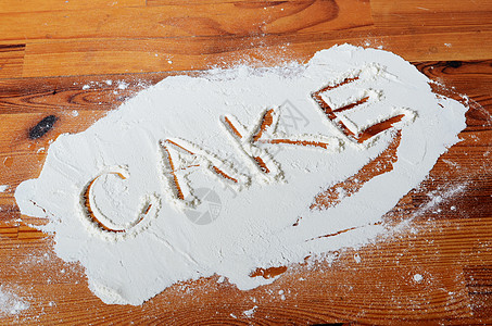 面粉桌面烤蛋糕烹饪字母白色木头食物桌子烘烤背景