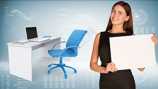 商业女商务人士持有纸页 下面是办公桌 有椅子和笔记本电脑床单日程成人坡度裙子桌子工作长发女性办公椅图片