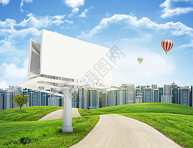 气球广告牌高高建筑 绿色山丘和有大型广告牌对天的公路草地窗户地面建筑学沥青场地天空爬坡气球房地产背景